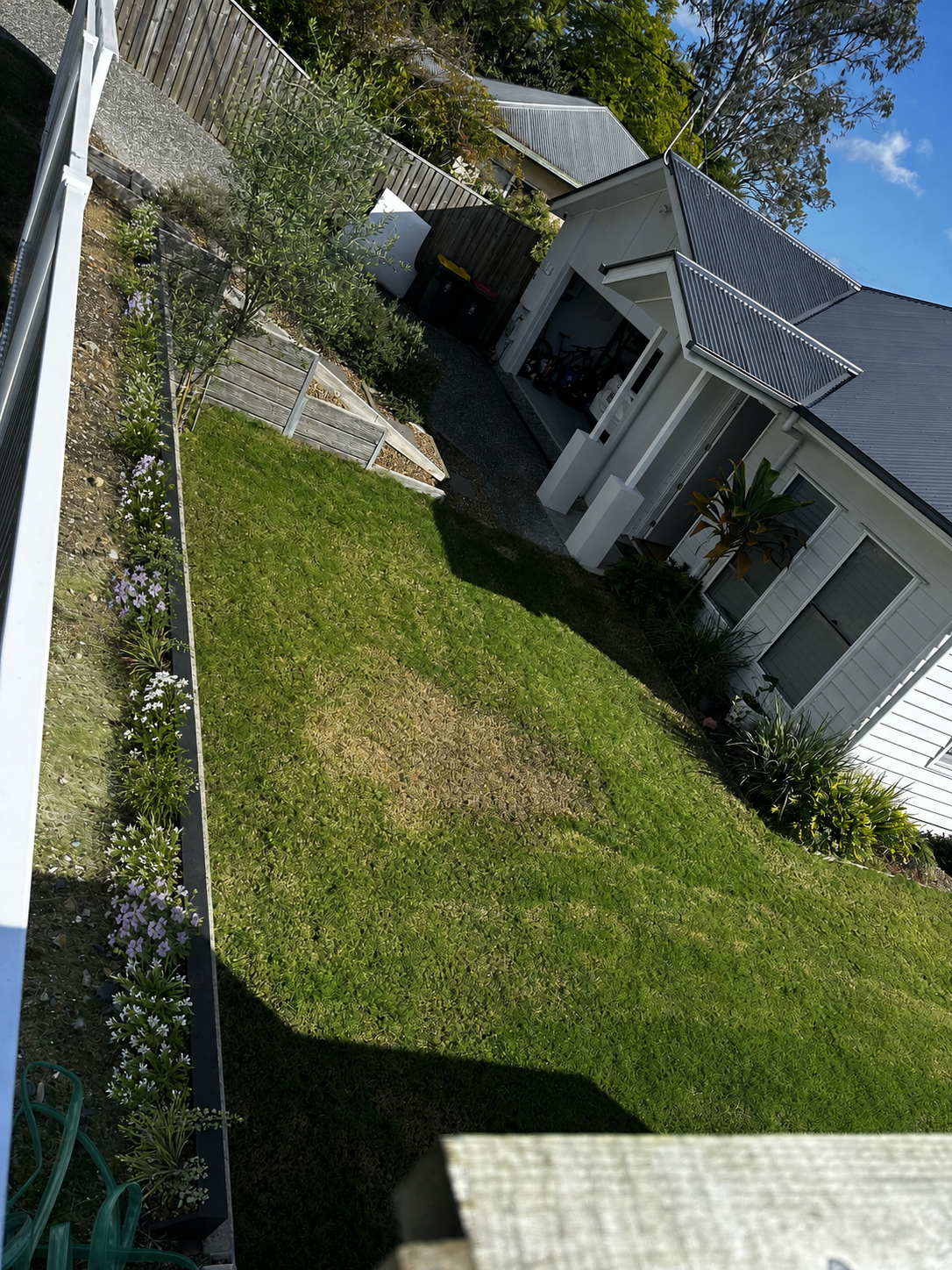 Alternate wide view of same slim raised planter along internal retaining ledge